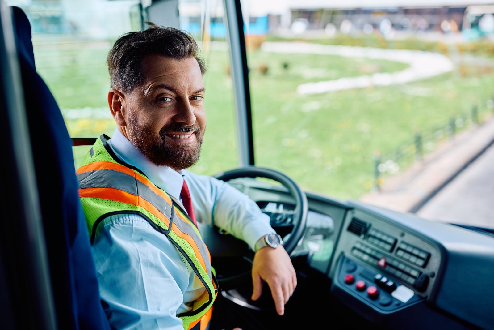 happy bus driver inside the bus looking at camera 2023 04 28 01 21 58 utc scaled